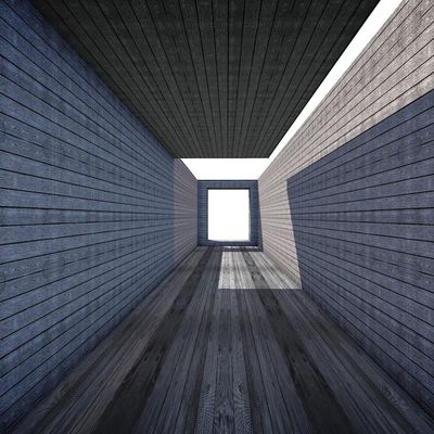 A clean, empty yoga mat on a dark wooden floor.