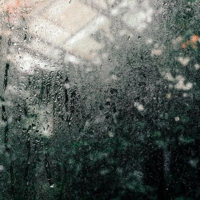 Water bottle with condensation on a dark background.